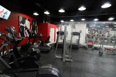 a gym with several treadms and cardio machines at Castle 1033 in Miami Beach