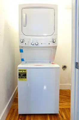 a video game system on top of a refrigerator at Broadwaysuites Downtown By RocketStay in Miami