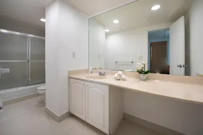 a bathroom with a sink and a mirror and a toilet at Paradise on Hollywood Beach 2 bed 2 bath in Hollywood
