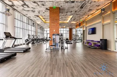 a gym with treadmills and cardio equipment in a room at Luxury 3 Br- Front Intercostal View - Amazing Pools in Hollywood