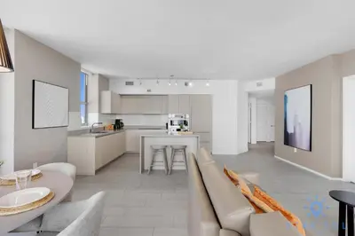 a living room and kitchen with a couch and a table at High-Floor with Stunning Views-Luxury Condo - Pools in Hollywood