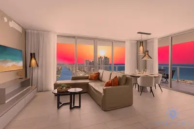 a living room with a couch and a table at Luxury 2Br Front Ocean & Bay View, Amazing Pools in Hollywood
