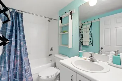 a bathroom with a white toilet and a sink at Welworth condo units Miami Beach in Miami Beach