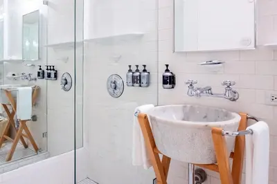 a bathroom with a sink and a shower at The Standard Spa, Miami Beach in Miami Beach