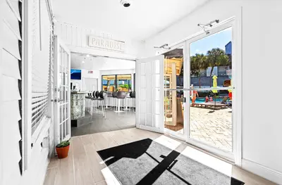 a room with a large window and a patio at Hotolos Hollywood in Hollywood