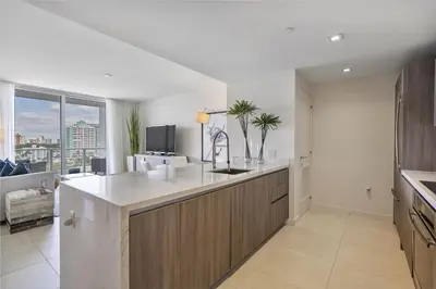 a kitchen with a sink and a counter top at 914 Tiffany House condo in Fort Lauderdale