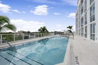 a large swimming pool on the side of a building at 914 Tiffany House condo in Fort Lauderdale