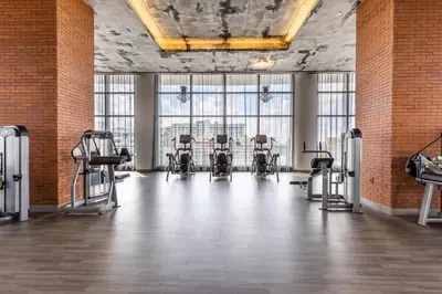 a gym with a row of chairs in a room with windows at Relaxing Getaway with Intracoastal Views in Hollywood