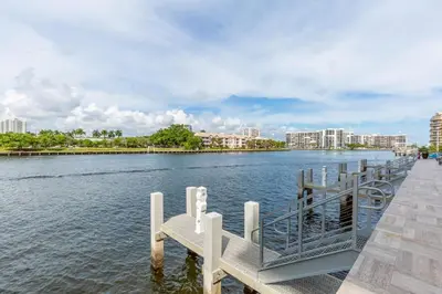 a dock with a bench next to the water at Relaxing Getaway with Intracoastal Views in Hollywood