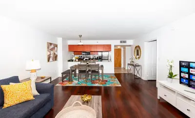 a living room with a couch and a table at Star Stay Miami Yellow Brickell in Miami