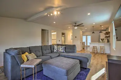 a living room with a couch and a table at Modern Home with Shared Pool in Fort Lauderdale! in Fort Lauderdale