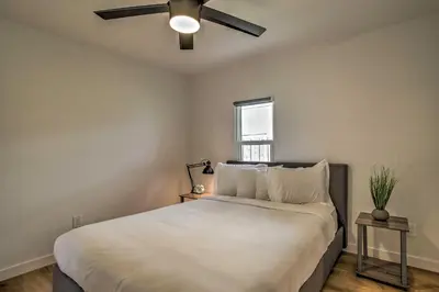 a bedroom with a bed with a ceiling fan at Modern Home with Shared Pool in Fort Lauderdale! in Fort Lauderdale