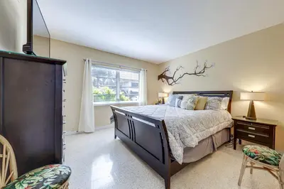 a bedroom with a large bed and a window at Ft Lauderdale Apt with Pool - 1 Mi to Beach Access! in Fort Lauderdale