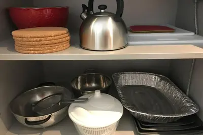 a shelf with dishes and a tea pot and plates at Hollywood Beach luxury condo-HBH in Hollywood