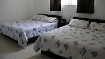 two beds sitting next to each other in a bedroom at THE TIDES on MIAMI HOLLYWOOD in Hollywood