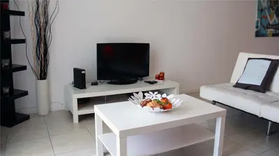 a living room with a bowl of fruit on a table at THE TIDES on MIAMI HOLLYWOOD in Hollywood