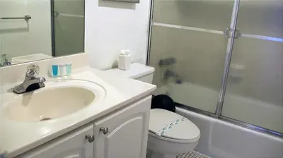 a bathroom with a sink and a toilet and a shower at THE TIDES on MIAMI HOLLYWOOD in Hollywood