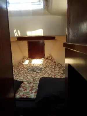 a bed in a small room with a window at Unique perspective in Miami