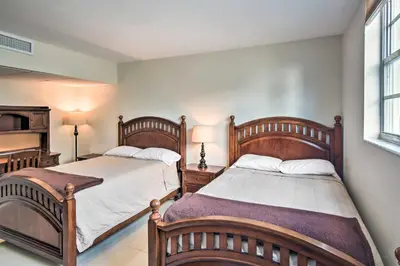 a bedroom with two beds and a window at Beachfront Condo with Pool Access in Hollywood! in Hollywood