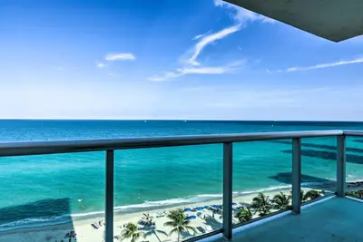 a view of the ocean from a balcony at Beachfront Condo with Pool Access in Hollywood! in Hollywood