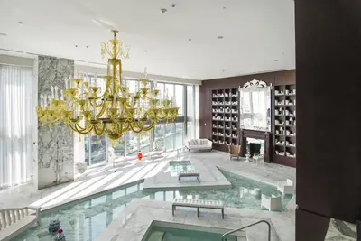 a large room with a pool and a chandelier at NEW!!! W Brickell Miami- ICON DELUXE LOUNGE with 2 masters in Miami