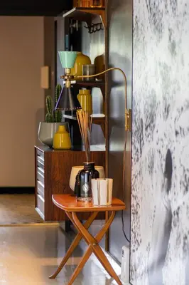 a table with cups on it next to a refrigerator at Blanc Kara- Adults Only in Miami Beach