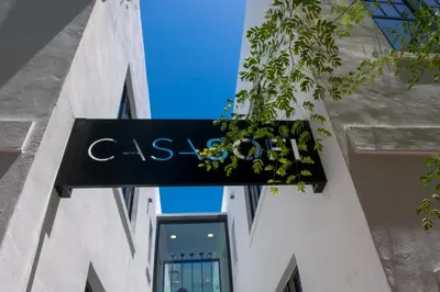 a sign for a store on the side of a building at Casa Sofi in Miami Beach