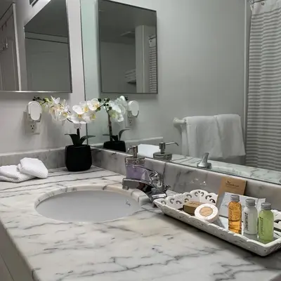 a bathroom counter with a sink and a mirror at Star Stay Miami Orange Brickell in Miami