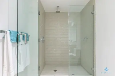 a shower with a glass door in a bathroom at Corner Balcony - Enjoy 360 Views- Near Beach- Pool in Hollywood