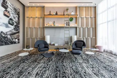 a room with chairs and a table and a shelf at Hyde Beach House Luxury Condo-Resort 1204 condo in Hollywood Beach