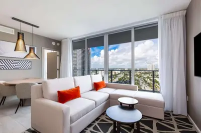 a living room with a white couch and a large window at Hyde Beach House Luxury Condo-Resort 1204 condo in Hollywood Beach