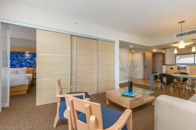 a hotel room with a bed and a living room at 2 BR Luxury Suite in Marenas Beach Resort 2508 condo in Miami Beach