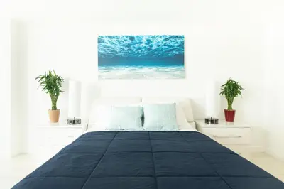 a bedroom with a large black bed with two plants at ICON BRICKELL-29th FLOOR OCEAN VIEWS-FREE SPA in Miami
