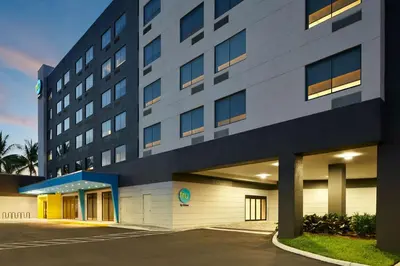 a building with a parking lot in front of it at Tru By Hilton Ft Lauderdale Airport in Dania Beach