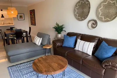 a living room with a couch and a table at Beautiful Apartment Steps Away from the Beach in Miami Beach