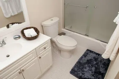 a bathroom with a toilet and a sink and a shower at Beautiful Apartment Steps Away from the Beach in Miami Beach