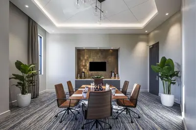 a conference room with a table and chairs at THesis Hotel Miami Coral Gables, Curio Collection by Hilton in Miami