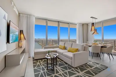 a living room with a couch and a table at Luxury with stunning view, Balcony, Amazing Pools in Hollywood