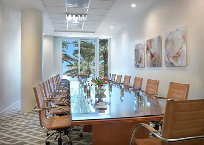 a conference room with a long table and chairs at Grand Beach Hotel Surfside in Miami Beach