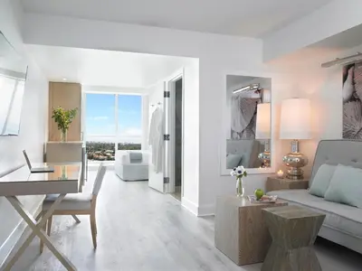 a living room with a couch and a table at Grand Beach Hotel Surfside in Miami Beach