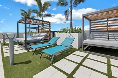 a patio with two chairs and a gazebo at Provident Grand Luxury Short-Term Residences in Miami