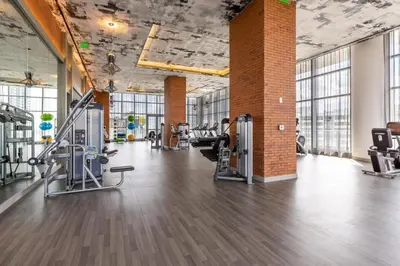 a gym with treadmills and elliptical machines at Penthouse 2 Terraces Ocean Views Beach Access in Hollywood