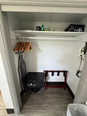 a room with a shelf and a table in a room at Rolo Beach Hotel in Fort Lauderdale