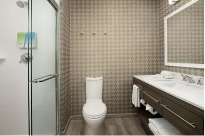 a bathroom with a toilet and a sink and a shower at Home2 Suites By Hilton Miami Doral West Airport, Fl in Miami
