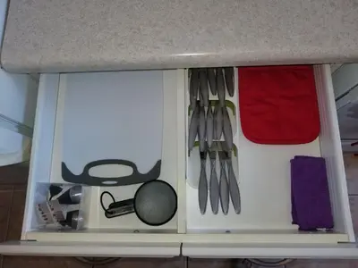 a drawer with utensils in a kitchen at FAMILY Guayabita's House in Miami