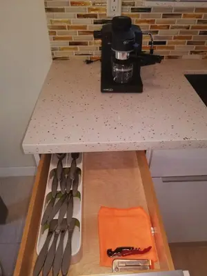 a kitchen counter with a table with knives on it at LUXURY Guayabita's House in Miami