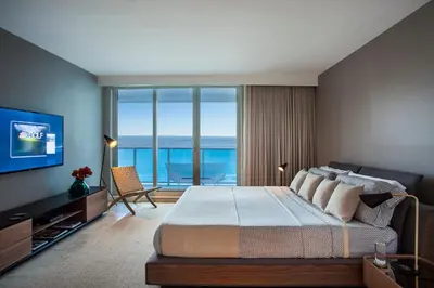 a bedroom with a large bed with a view of the ocean at Incredible Ocean Views! Terrace, 1800 sq.ft., Hotel in Miami Beach