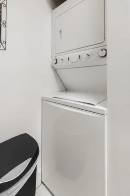 a white kitchen with a refrigerator and a microwave at Miami Downtown Brickell spacious 4 Bedrooms 6 Beds in Miami