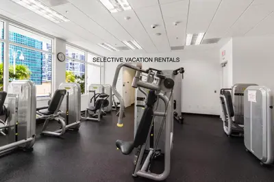 a gym with treadmills and cardio equipment in a building at Miami Downtown Brickell spacious 4 Bedrooms 6 Beds in Miami