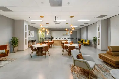 a waiting room with tables and chairs in a building at Miami Downtown Brickell spacious 4 Bedrooms 6 Beds in Miami